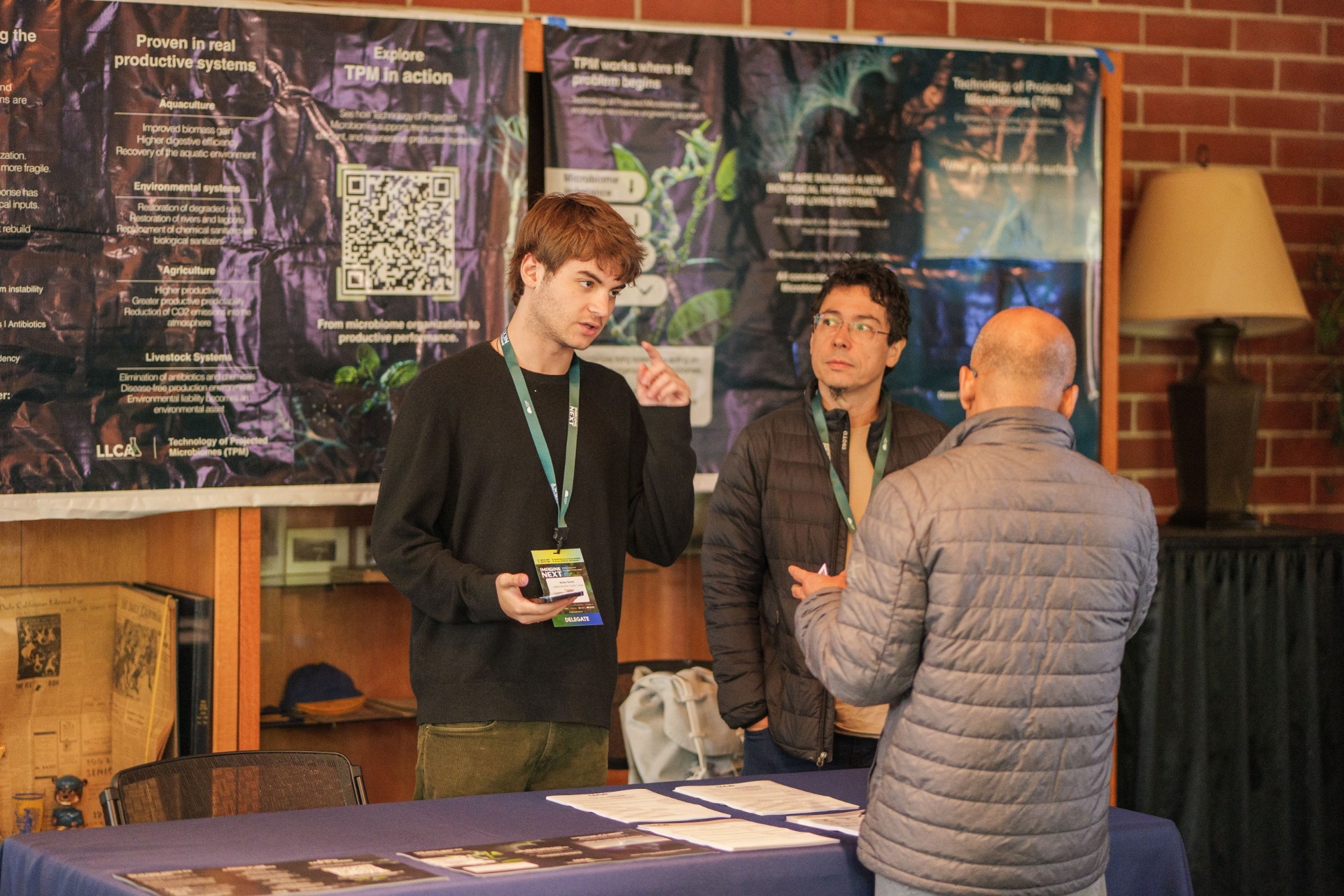 Delegates discussing TPM biotechnology poster