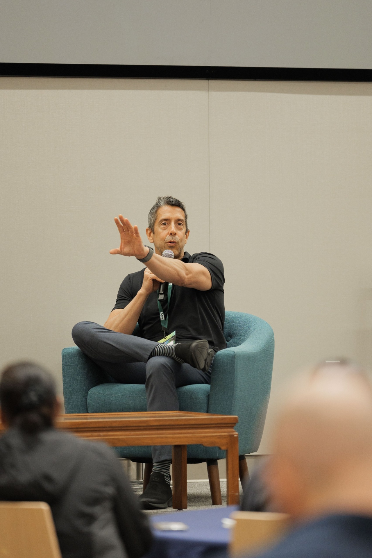 Troy Helming of Earthgrid gesturing while answering an audience question during the Capital Day fireside at UC Law SF