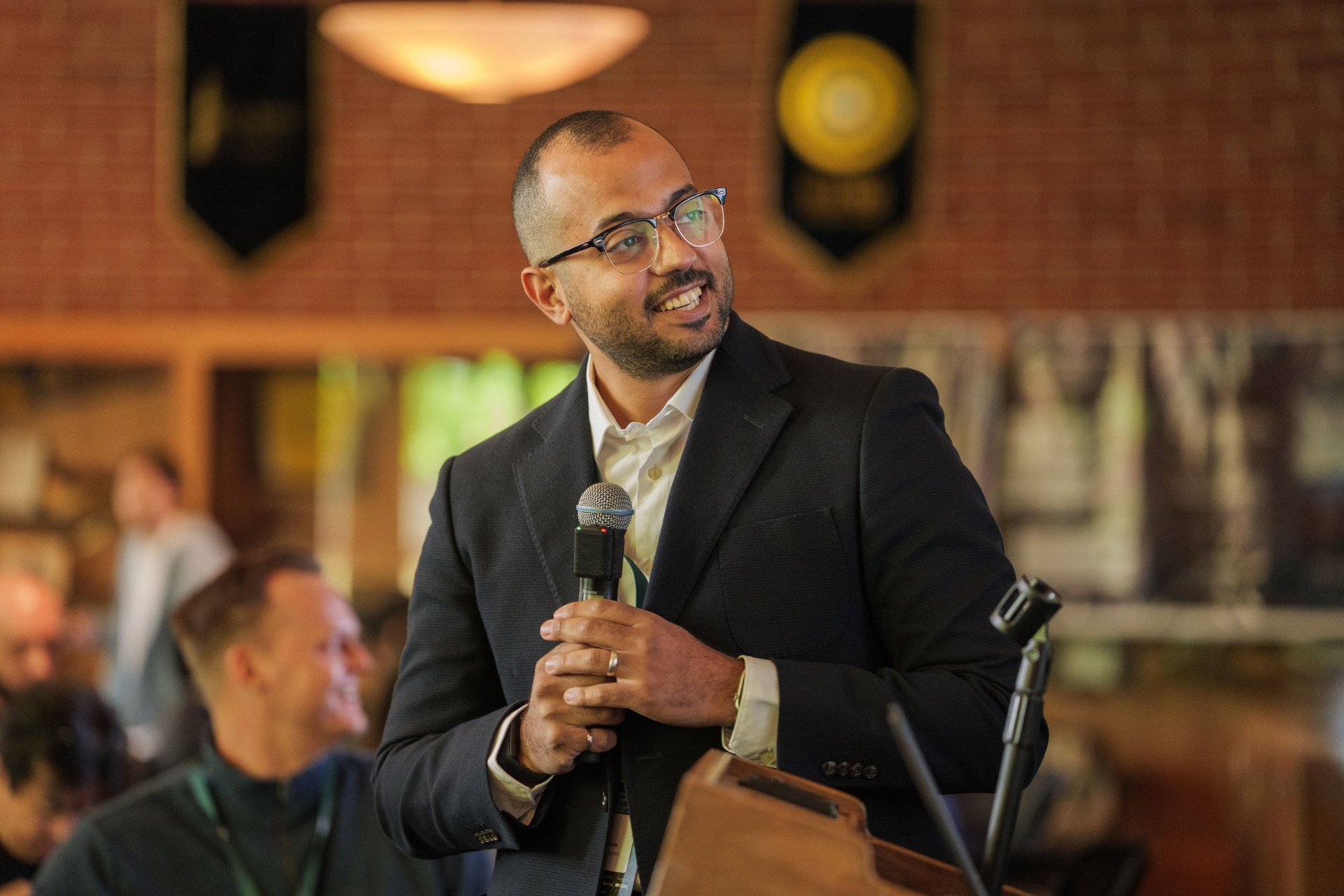 Resiliocs Intelligence founder smiling at the podium
