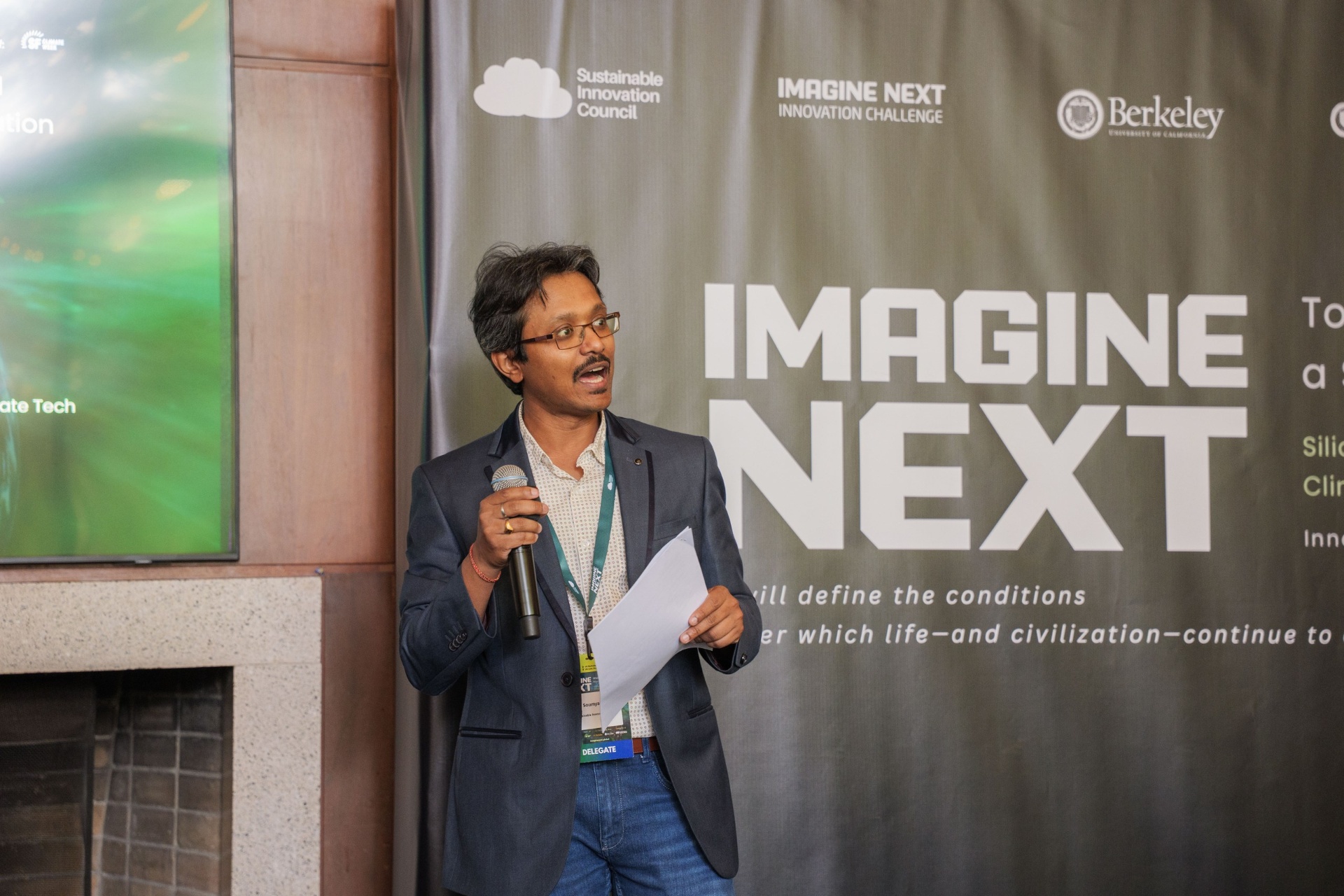 Soumya Ranjan Bej speaking by the Imagine Next banner